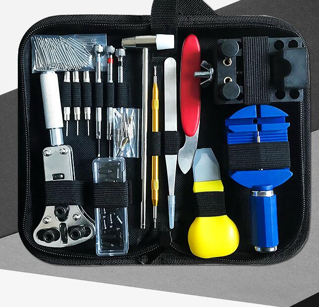 Set of tools in a black case on a gray background
